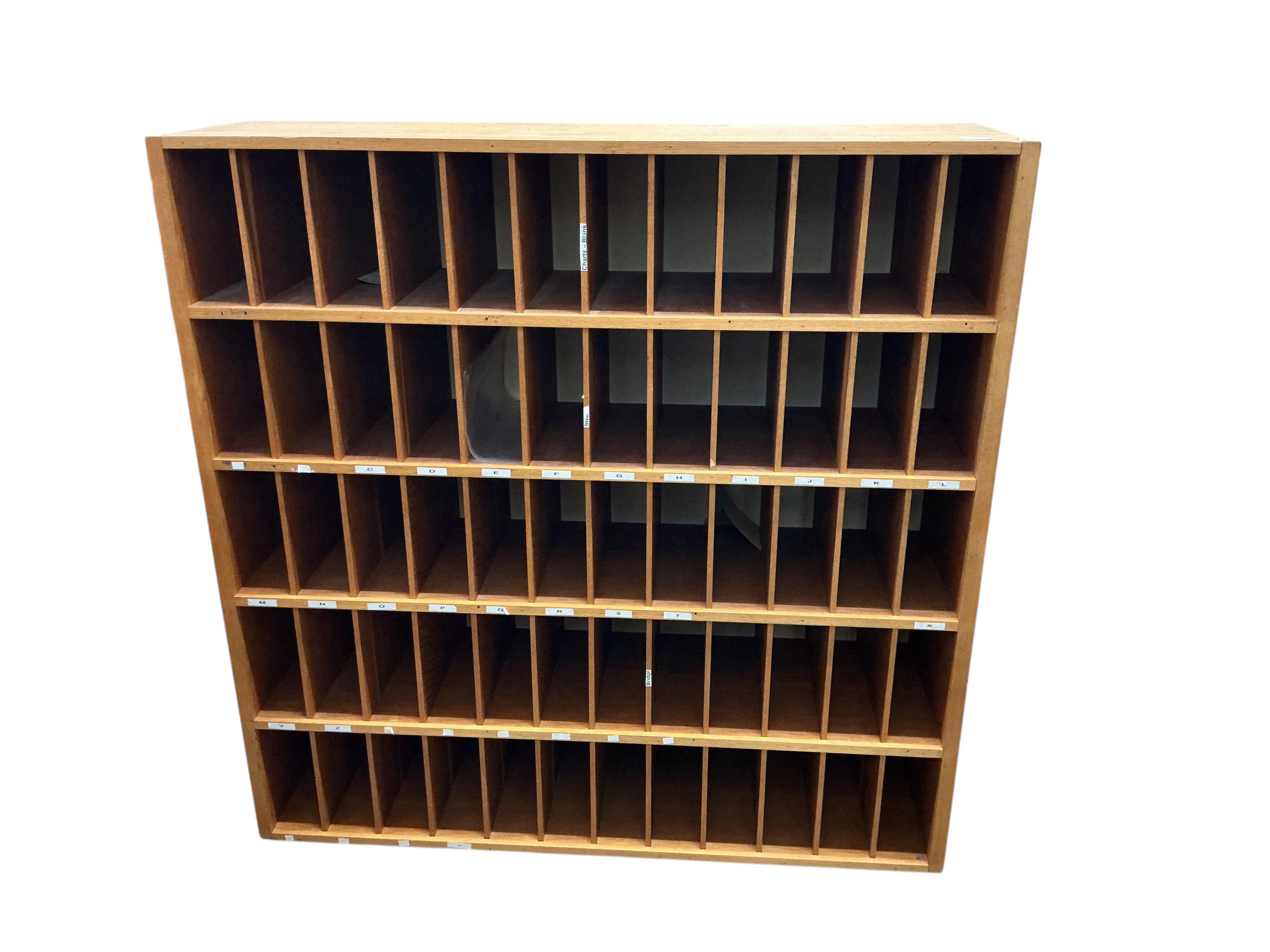 A mid century oak pigeonhole unit, width 122cm, depth 33cm, height 124cm